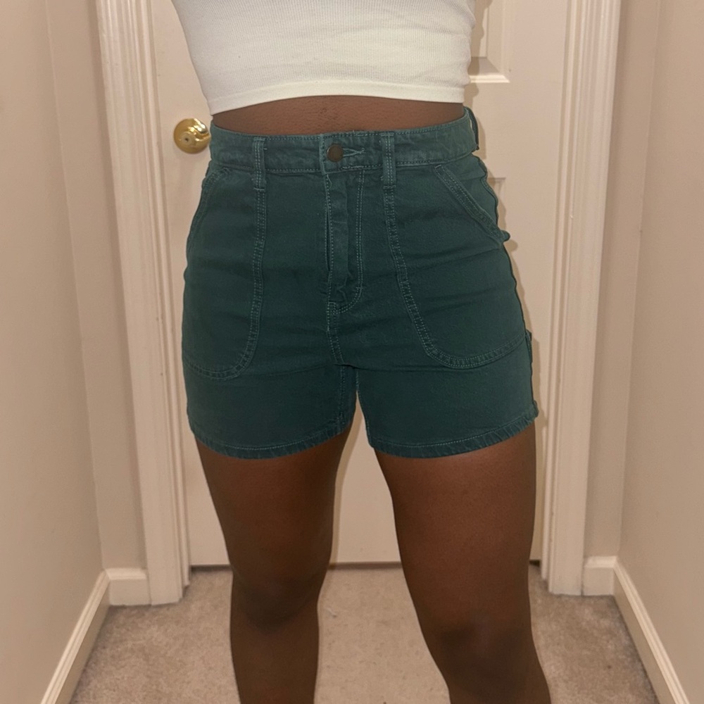 green denim shorts